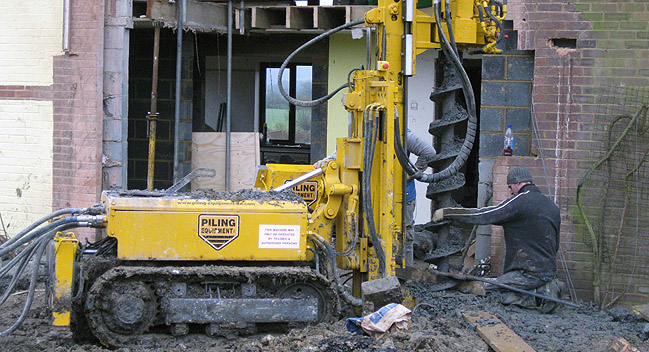 Drill rig used for restricted foundations for new rear extension.